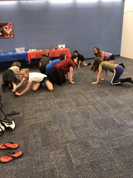 Teens Crawling on Floor