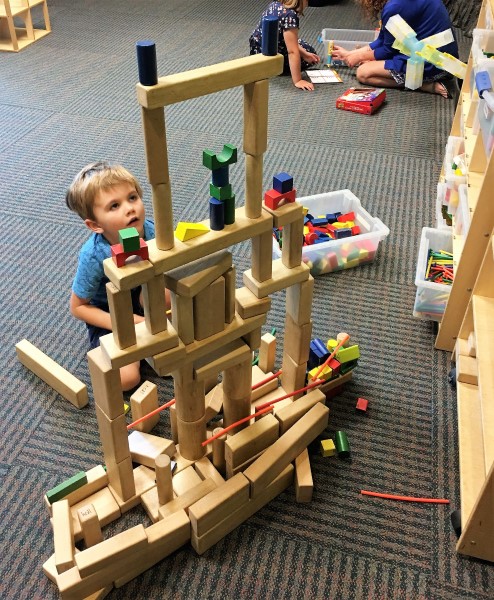 Boy Playing with Blocks in the Build It Room
